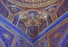 Finely ornamented ceiling of madrasah